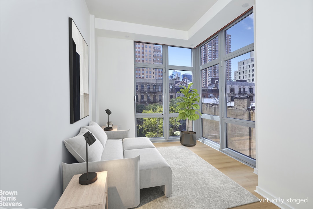310 West 52nd Street, Unit 5B Manhattan, NY 10019 - Photo 3 of 15 a living room with furniture and a potted plant