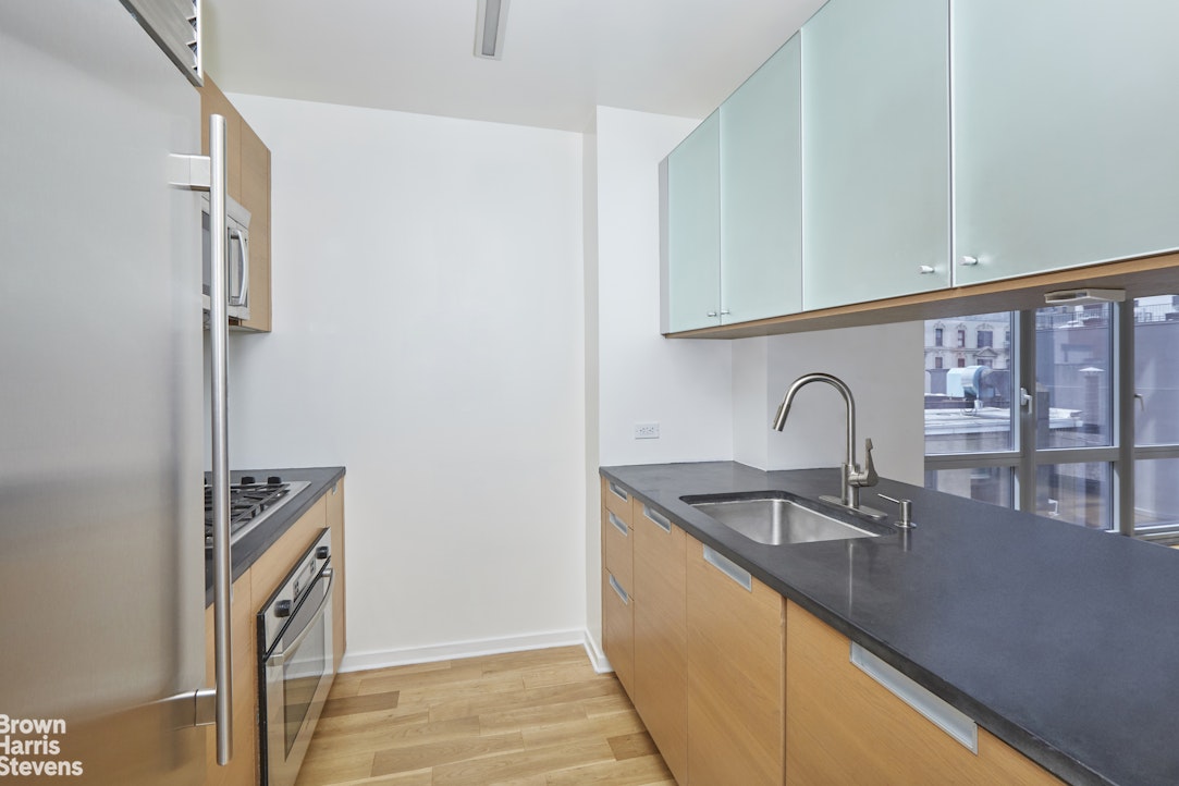 310 West 52nd Street, Unit 5B Manhattan, NY 10019 - Photo 4 of 15 a close view of sink and tap