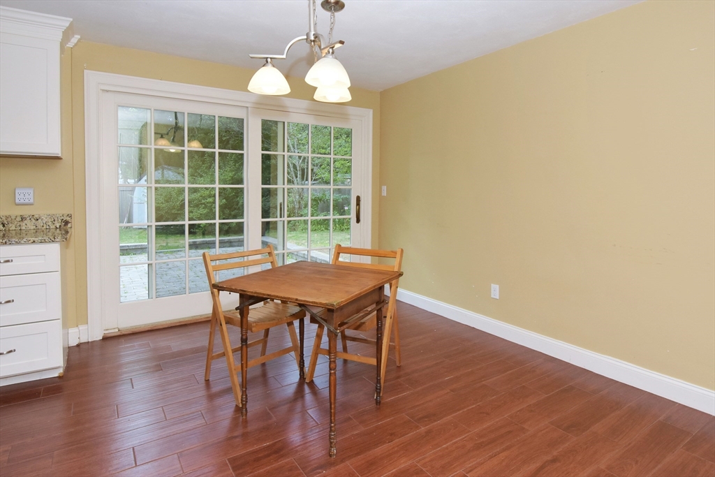 4 Allen Lane Ipswich, MA 01938 - Photo 11 of 30 a view of a dining room with furniture window and wooden floor