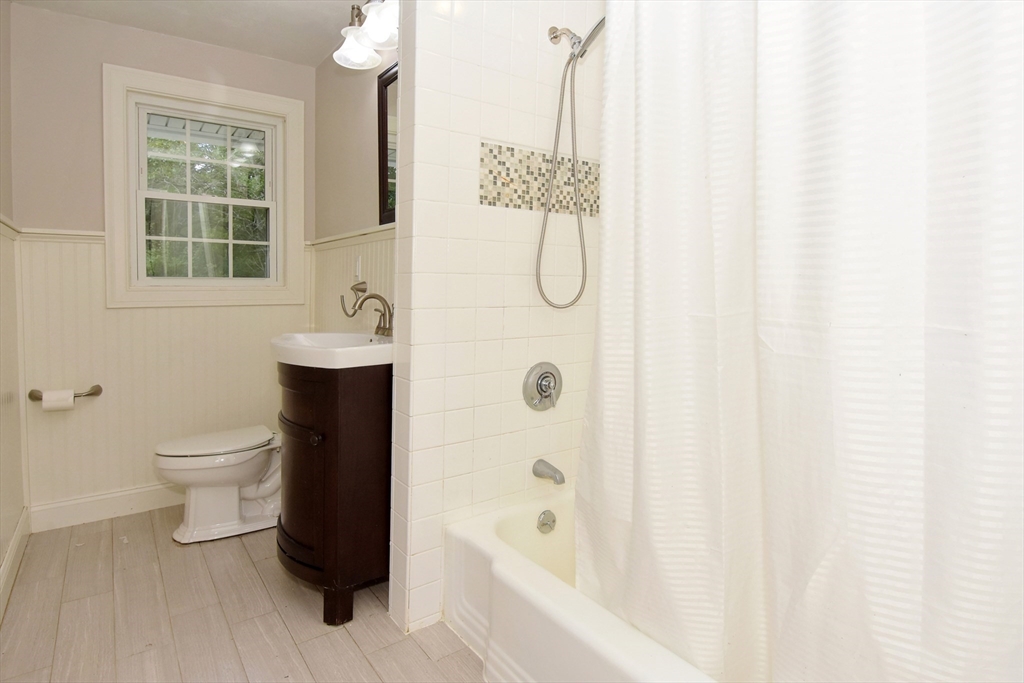 4 Allen Lane Ipswich, MA 01938 - Photo 14 of 30 a bathroom with a sink a toilet and shower