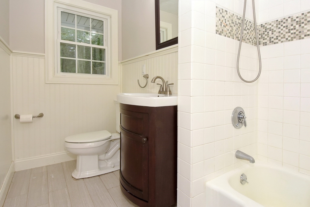 4 Allen Lane Ipswich, MA 01938 - Photo 15 of 30 a bathroom with a sink a toilet and shower