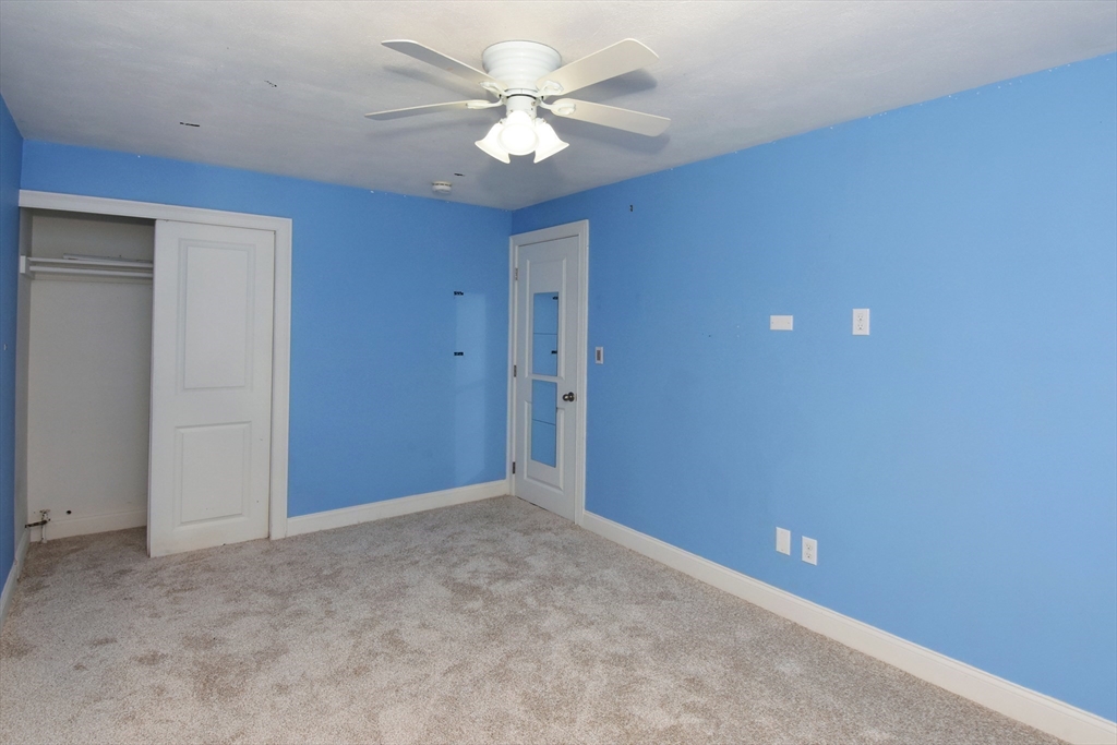 4 Allen Lane Ipswich, MA 01938 - Photo 19 of 30 an empty room with a ceiling fan and a window