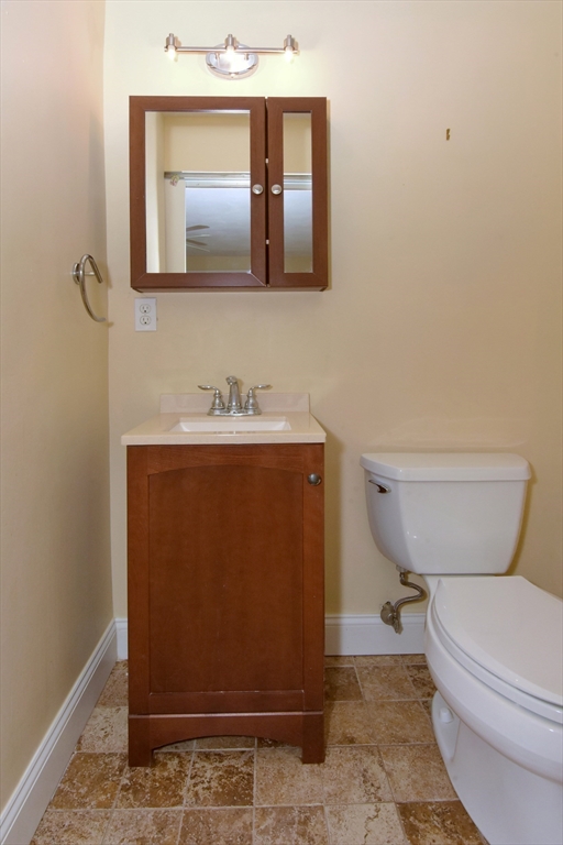 4 Allen Lane Ipswich, MA 01938 - Photo 23 of 30 a bathroom with a toilet a sink and mirror