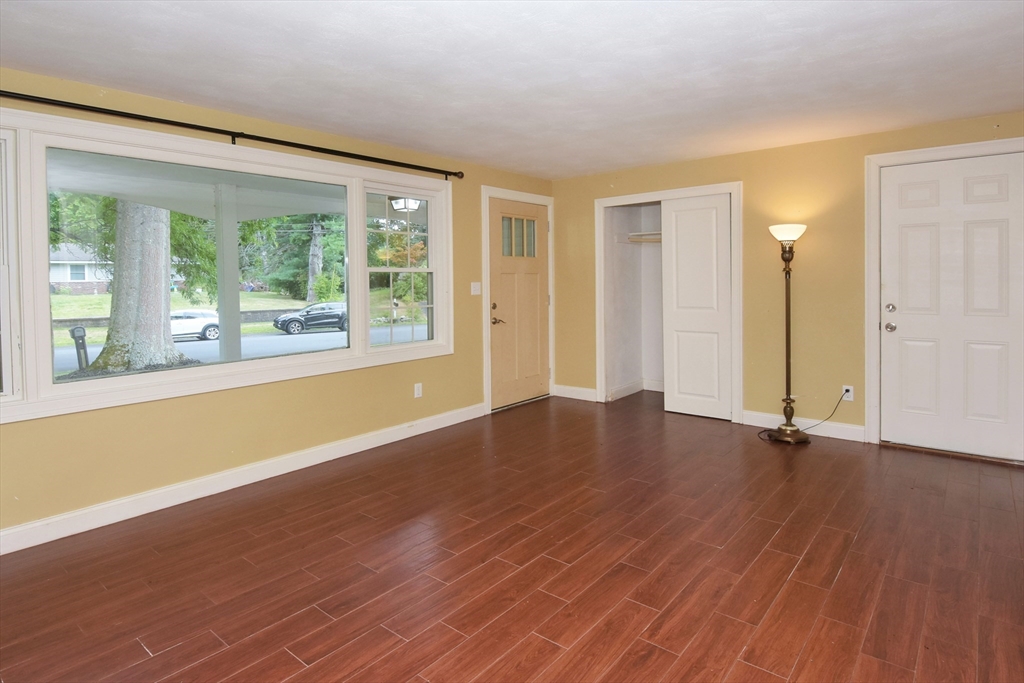 4 Allen Lane Ipswich, MA 01938 - Photo 4 of 30 a view of an empty room with wooden floor and a window
