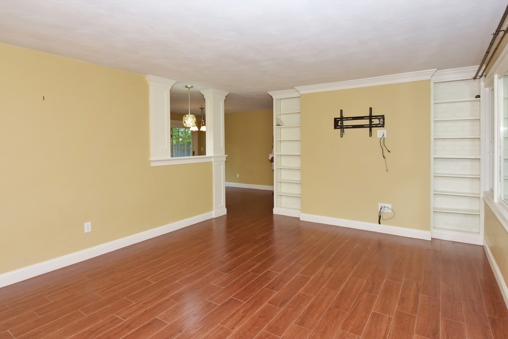 4 Allen Lane Ipswich, MA 01938 - Photo 5 of 30 a view of an empty room with closet and wooden floor