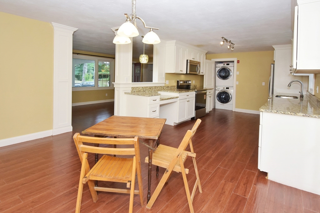 4 Allen Lane Ipswich, MA 01938 - Photo 7 of 30 a living room with stainless steel appliances kitchen island granite countertop furniture and a kitchen view
