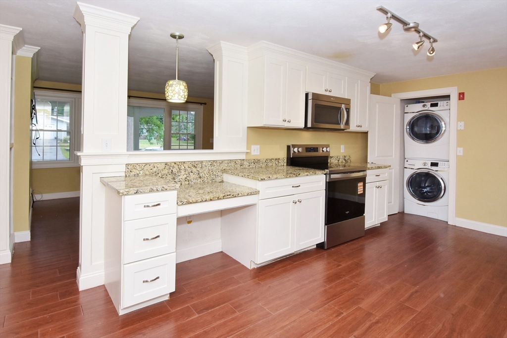 4 Allen Lane Ipswich, MA 01938 - Photo 8 of 30 a kitchen with granite countertop a stove top oven sink and cabinets