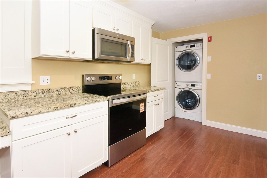 4 Allen Lane Ipswich, MA 01938 - Photo 10 of 30 a kitchen with a stove top oven sink and cabinets