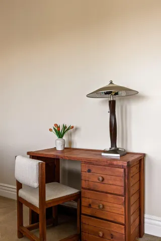 a view of a room with furniture and umbrella