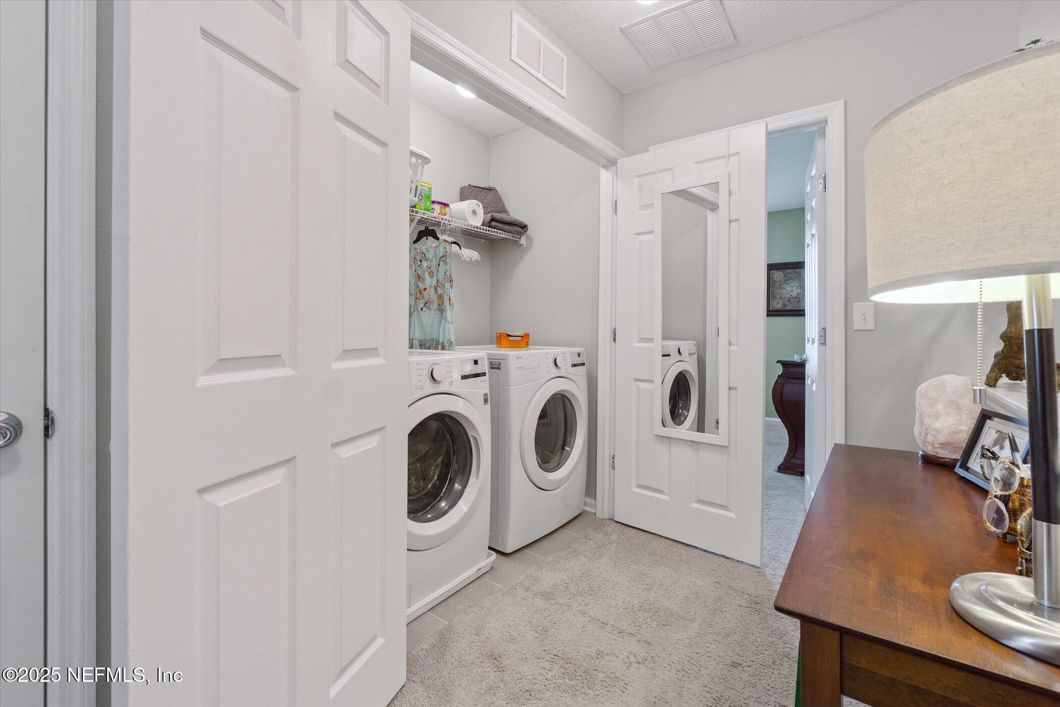 7821 Merchants Way Jacksonville, FL 32222 - Photo 27 of 35 a utility room with dryer and washer