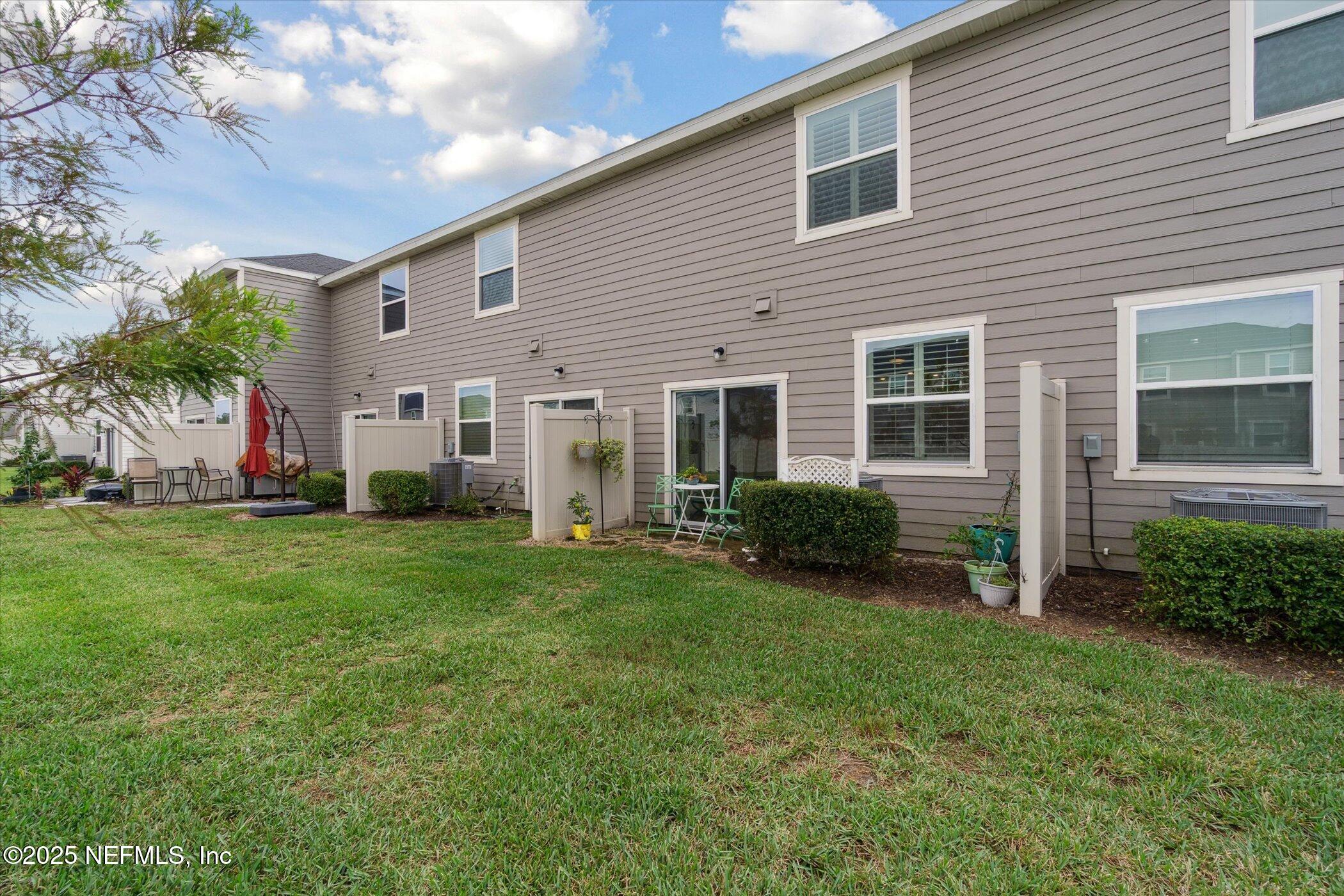 7821 Merchants Way Jacksonville, FL 32222 - Photo 31 of 35 a front view of house with yard and green space