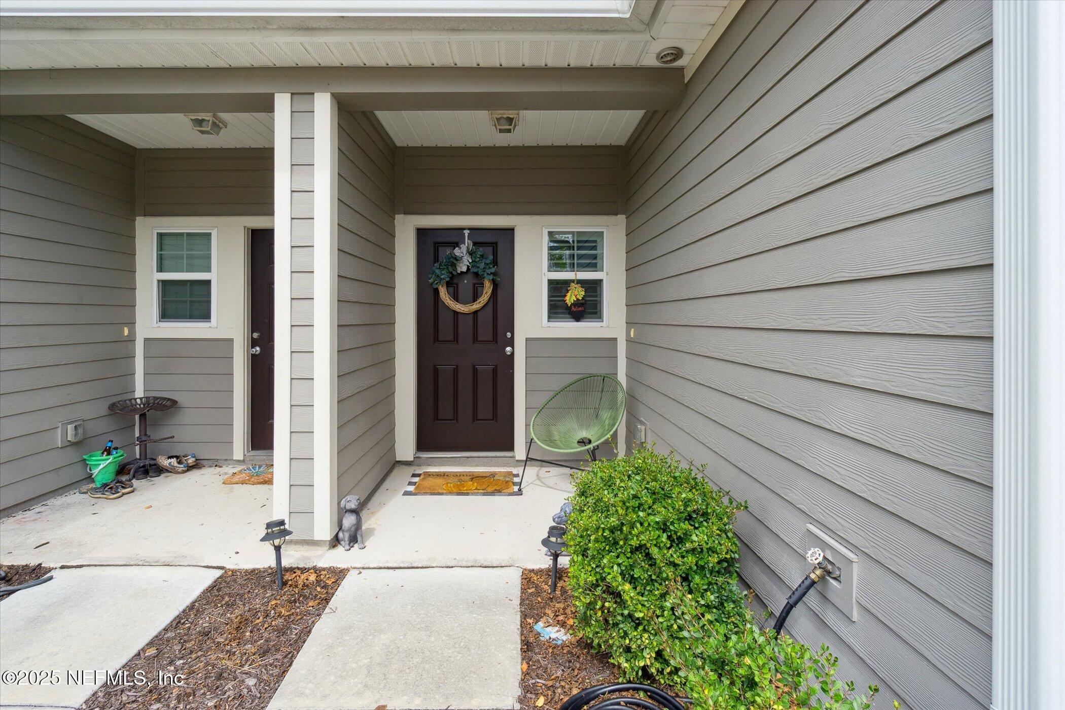 7821 Merchants Way Jacksonville, FL 32222 - Photo 34 of 35 a backyard of a house with table and chairs