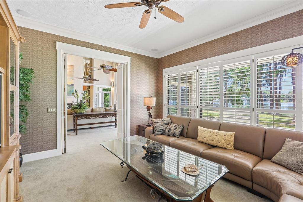 17810 Crawley Road Odessa, FL 33556 - Photo 24 of 76 a living room with furniture and a large window