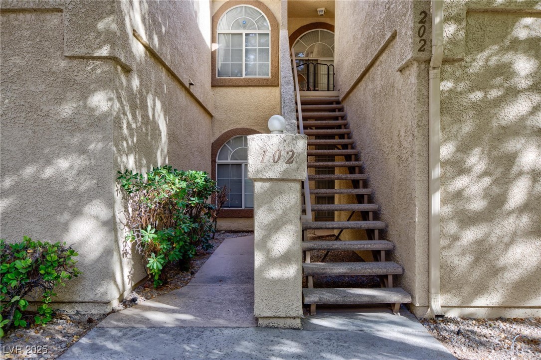 3673 Ian Thomas Street, Unit 102 Las Vegas, NV 89129 - Photo 12 of 15 View of staircase