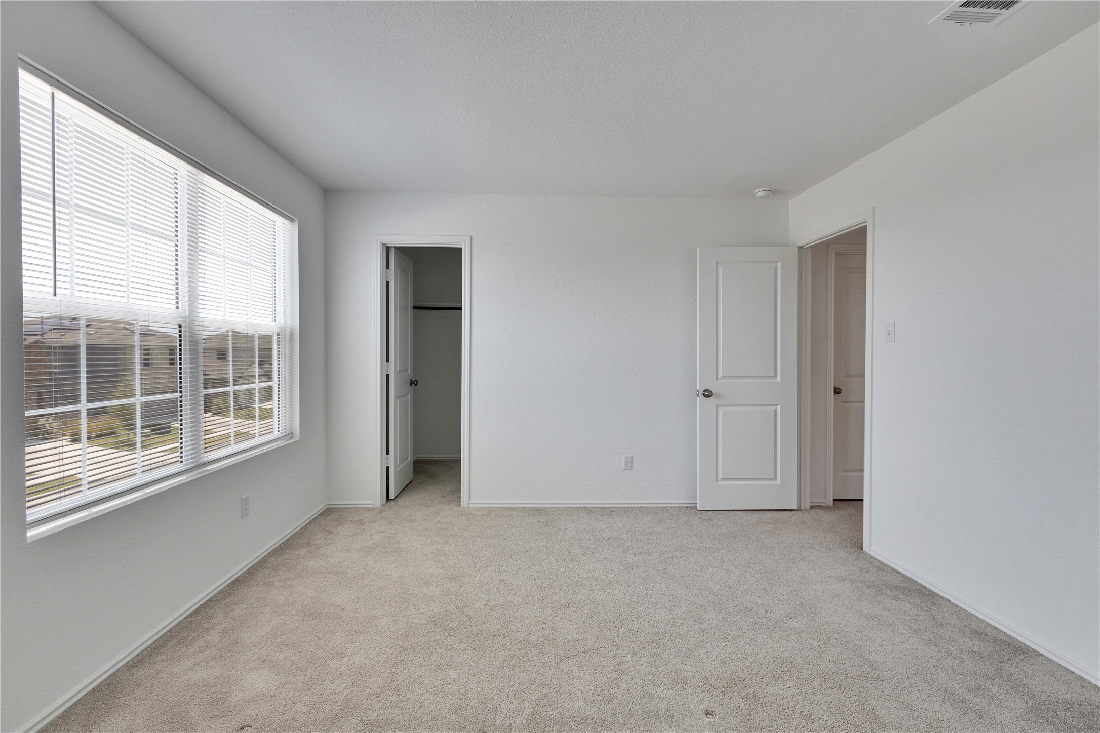 206 Canley Loop Hutto, TX 78634 - Photo 27 of 31 Upstairs bedroom with a walk in closet.