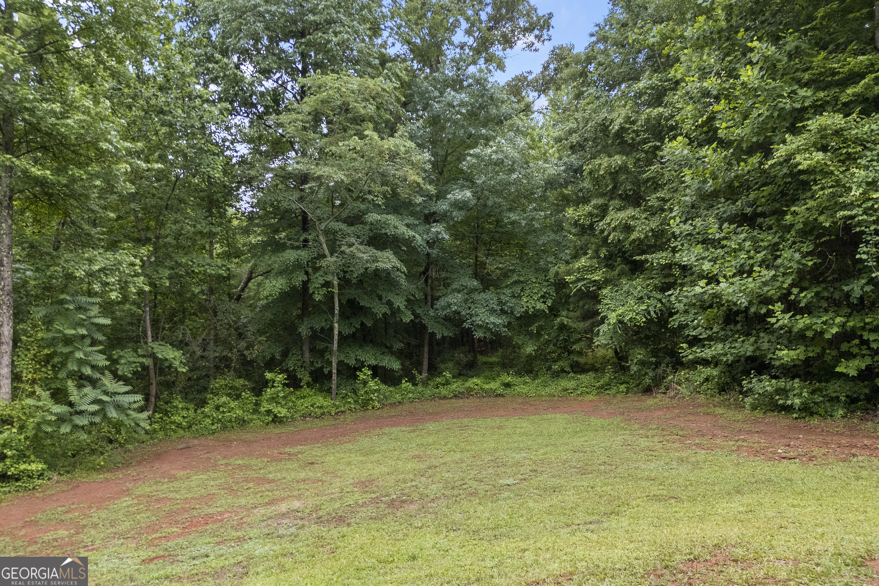 717 Oconee Lane Commerce, GA 30529 - Photo 51 of 57 a view of a field with trees in the background