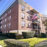 a view of a building with a yard