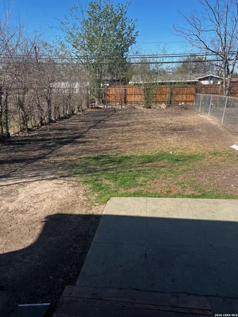 a view of a yard with an outdoor space