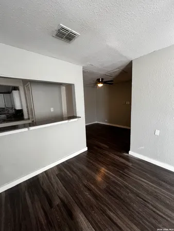 a view of wooden floor in an empty room