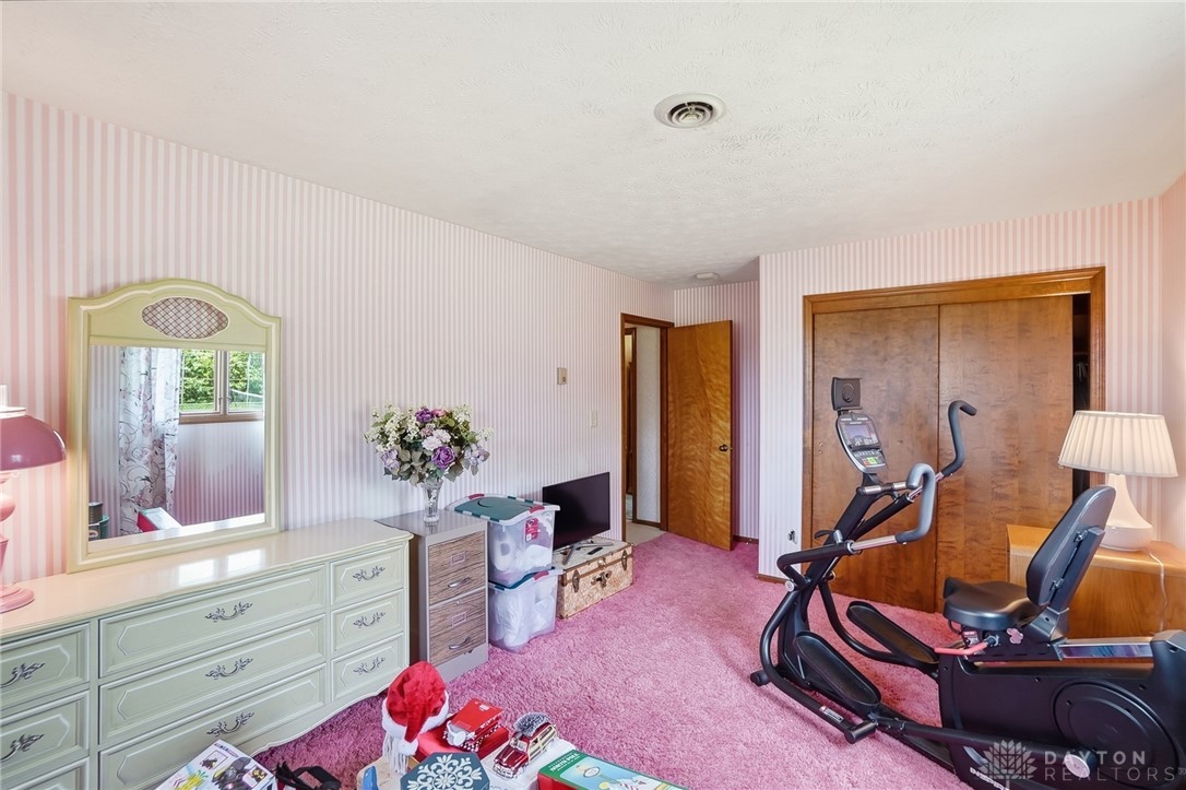 5669 O Neall Road Waynesville, OH 45068 - Photo 39 of 72 This cozy bedroom features plush carpeting and a convenient closet, ideal for comfortable living.