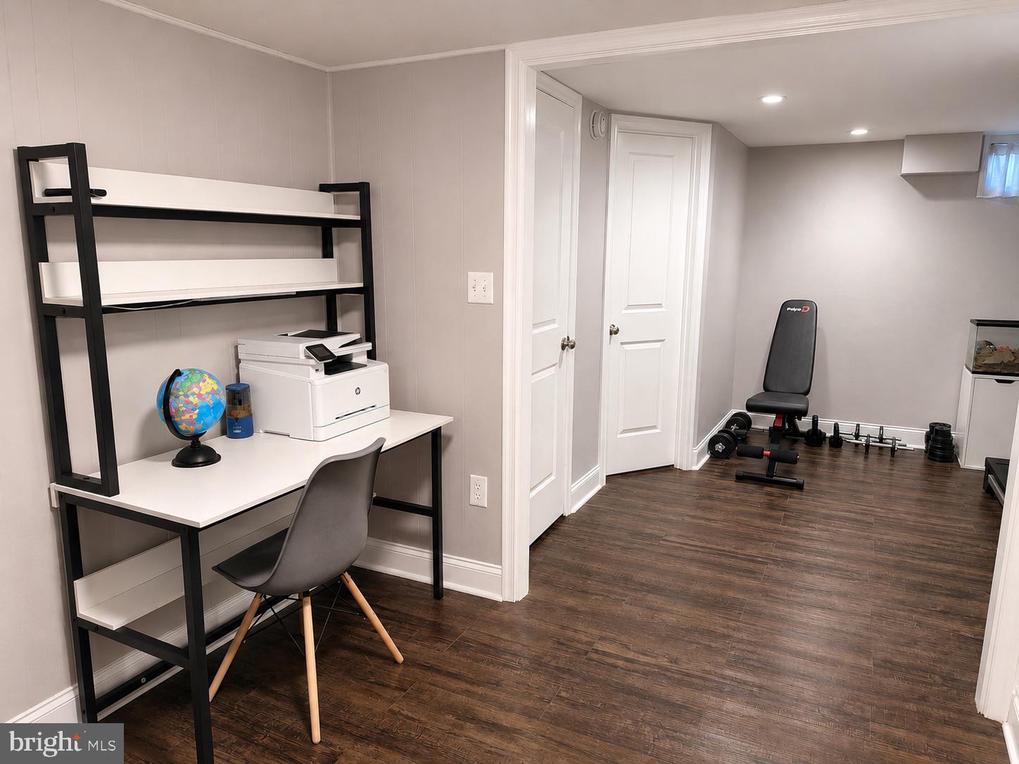 2235 Southorn Road Baltimore, MD 21220 - Photo 24 of 33 a view of a workspace with furniture and wooden floor