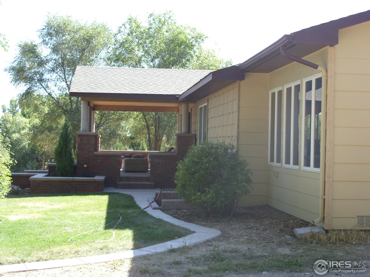 6825 East County Line Road Longmont, CO 80504 - Photo 3 of 22 a view of a house with backyard and porch