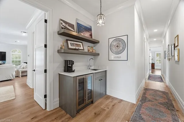 a view of entryway with furniture and wooden floor