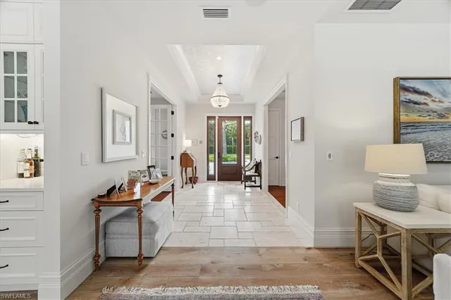 a living room with furniture and a dresser