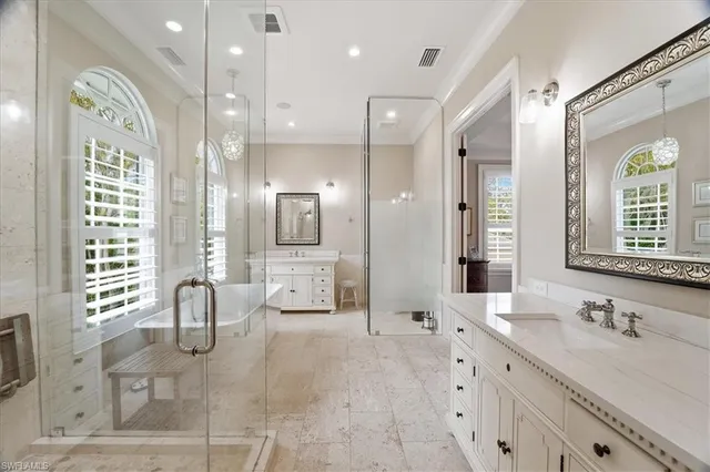 a spacious bathroom with a double vanity sink mirror and double
