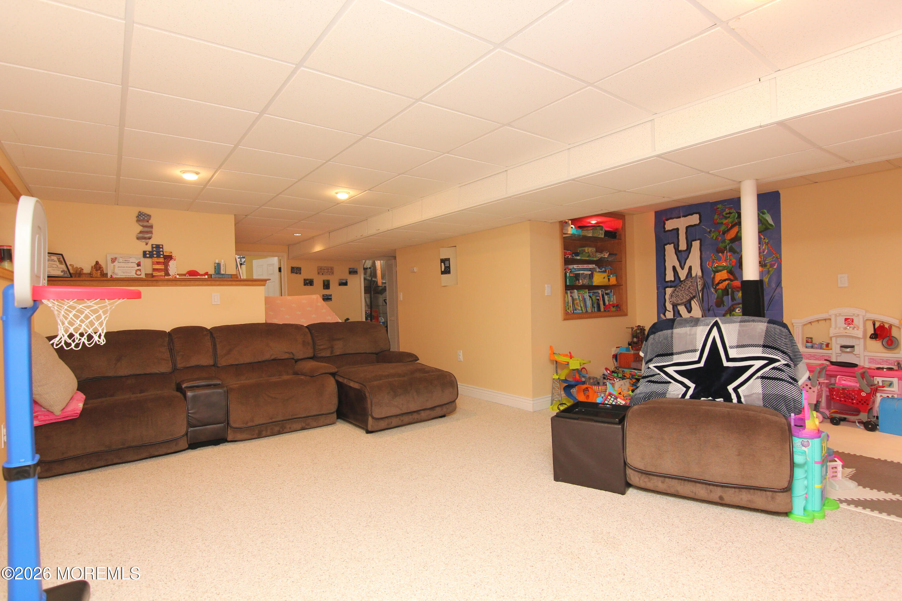 33 Austin Street Tinton Falls, NJ 07712 - Photo 23 of 46 a living room with furniture and a flat screen tv