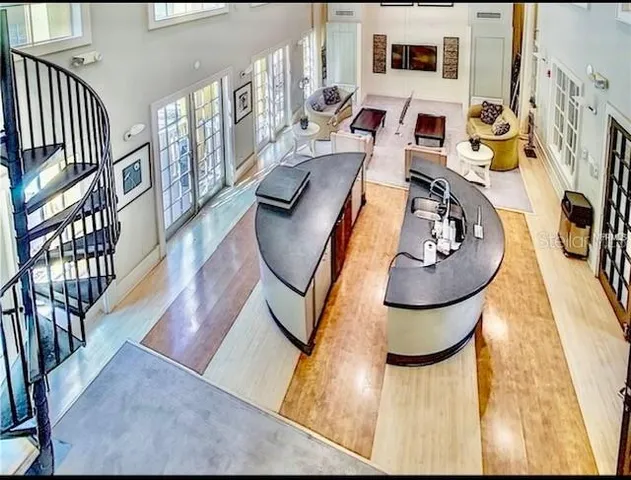 a kitchen with kitchen island a sink and a refrigerator
