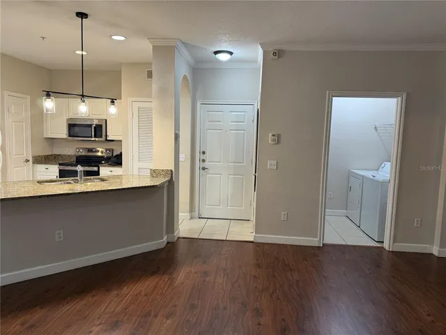 a kitchen with a sink and cabinets