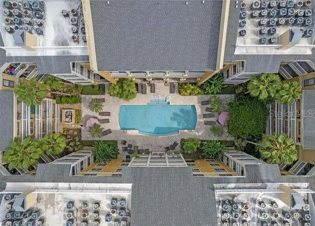 a view of a swimming pool and lounge chairs