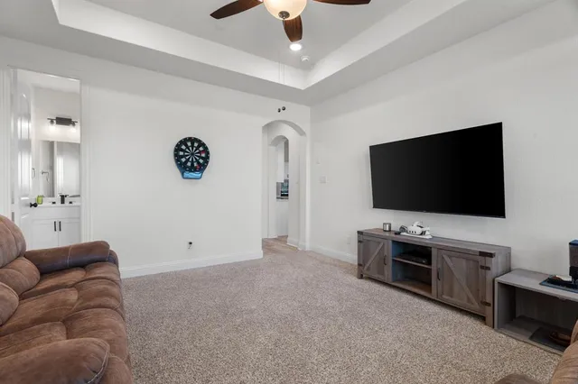 a bathroom with a sink mirror vanity and toilet