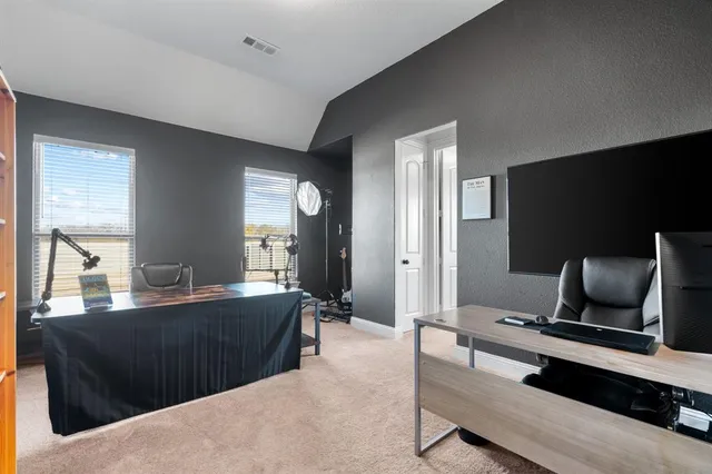 a workspace with furniture and a window