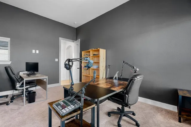 a bedroom with a bed lamp and window