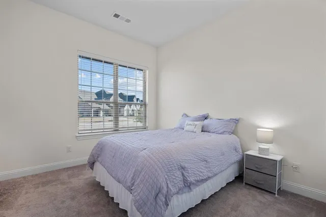 a bathroom with a sink mirror vanity and toilet