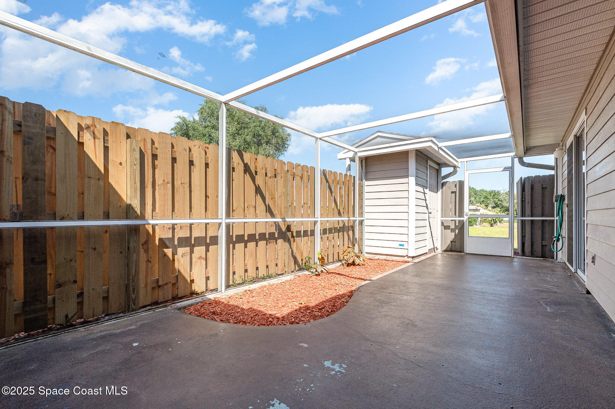 1920 Quail Ridge Court, Unit 2101 Cocoa, FL 32926 - Photo 25 of 50 Screened Patio & Garden area