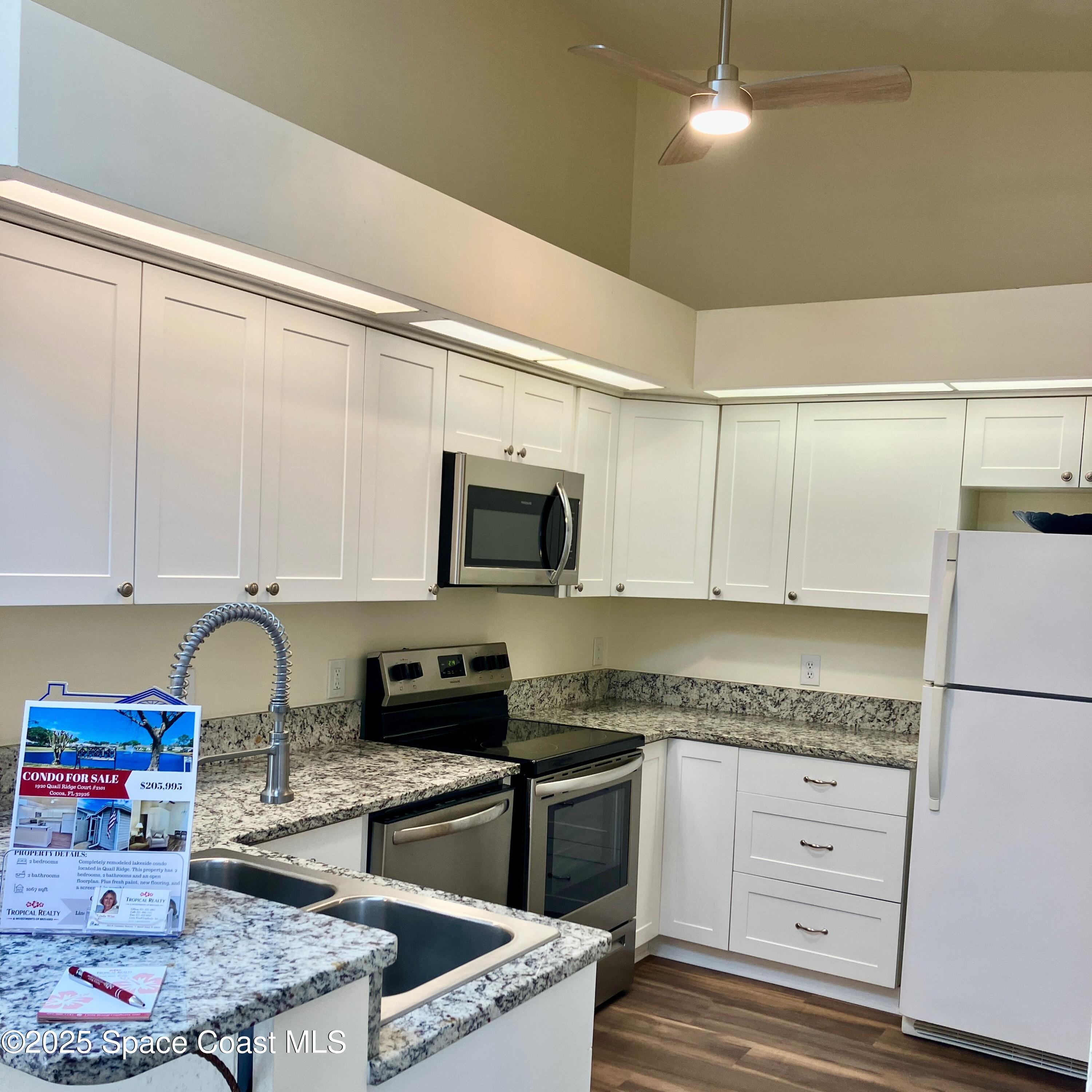 1920 Quail Ridge Court, Unit 2101 Cocoa, FL 32926 - Photo 32 of 50 High ceilings, lovely kitchen