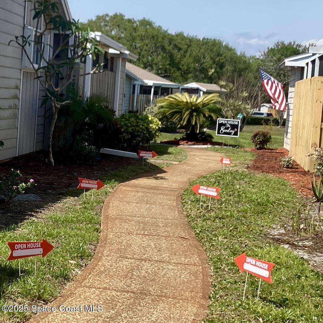 1920 Quail Ridge Court, Unit 2101 Cocoa, FL 32926 - Photo 39 of 50 Walk to unit #2101 in rear