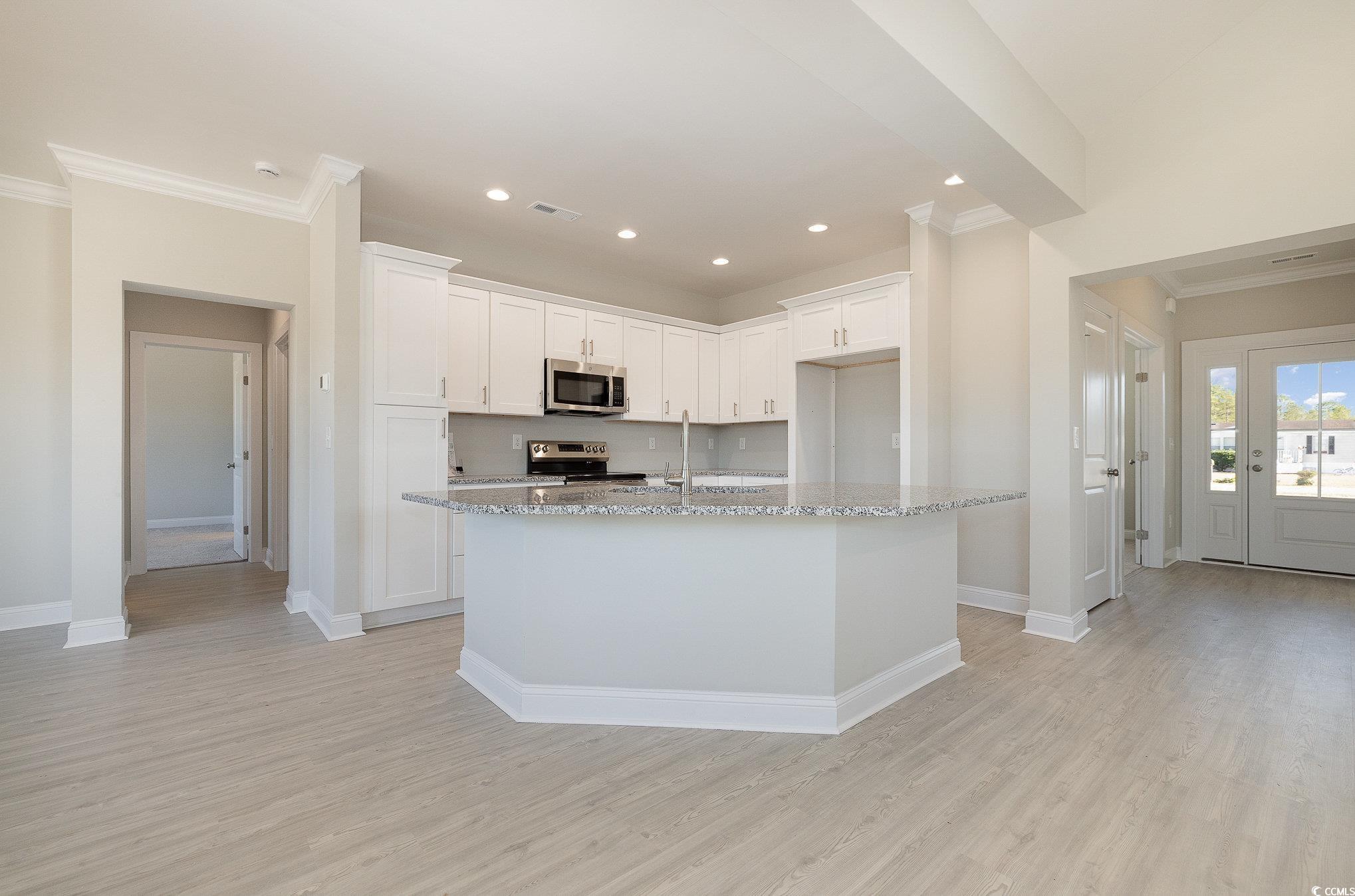 381 Log Cabin Road Loris, SC 29569 - Photo 12 of 35 Kitchen featuring white cabinetry, light stone cou