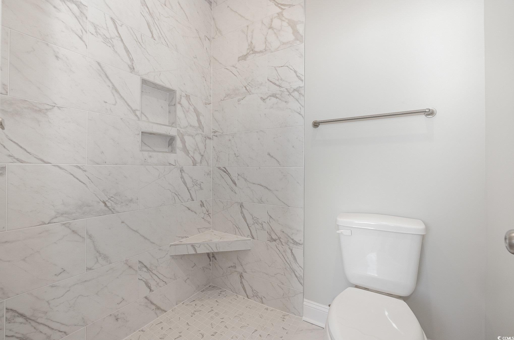 381 Log Cabin Road Loris, SC 29569 - Photo 20 of 35 Bathroom featuring tiled shower and toilet