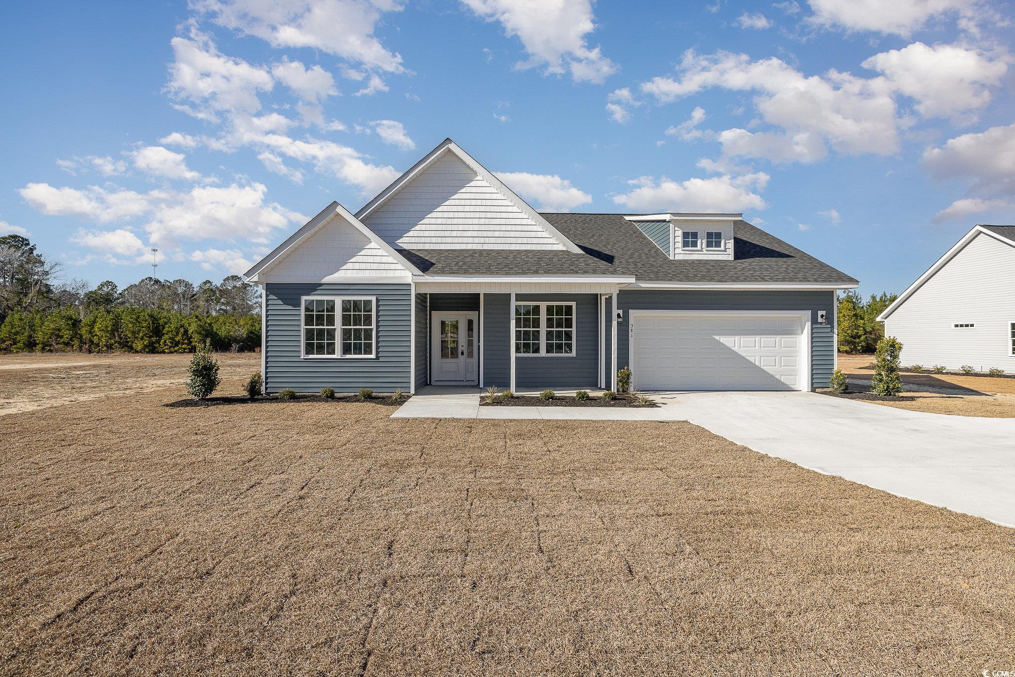 381 Log Cabin Road Loris, SC 29569 - Photo 2 of 35 View of front of house with a garage