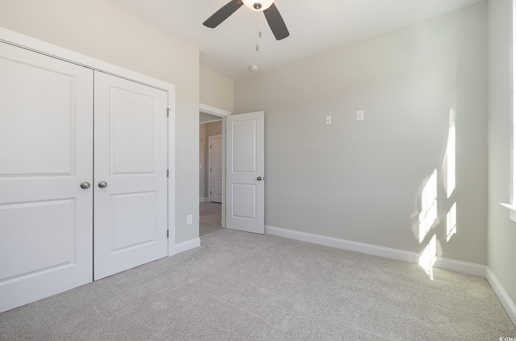 381 Log Cabin Road Loris, SC 29569 - Photo 25 of 35 Unfurnished bedroom featuring light carpet, a clos