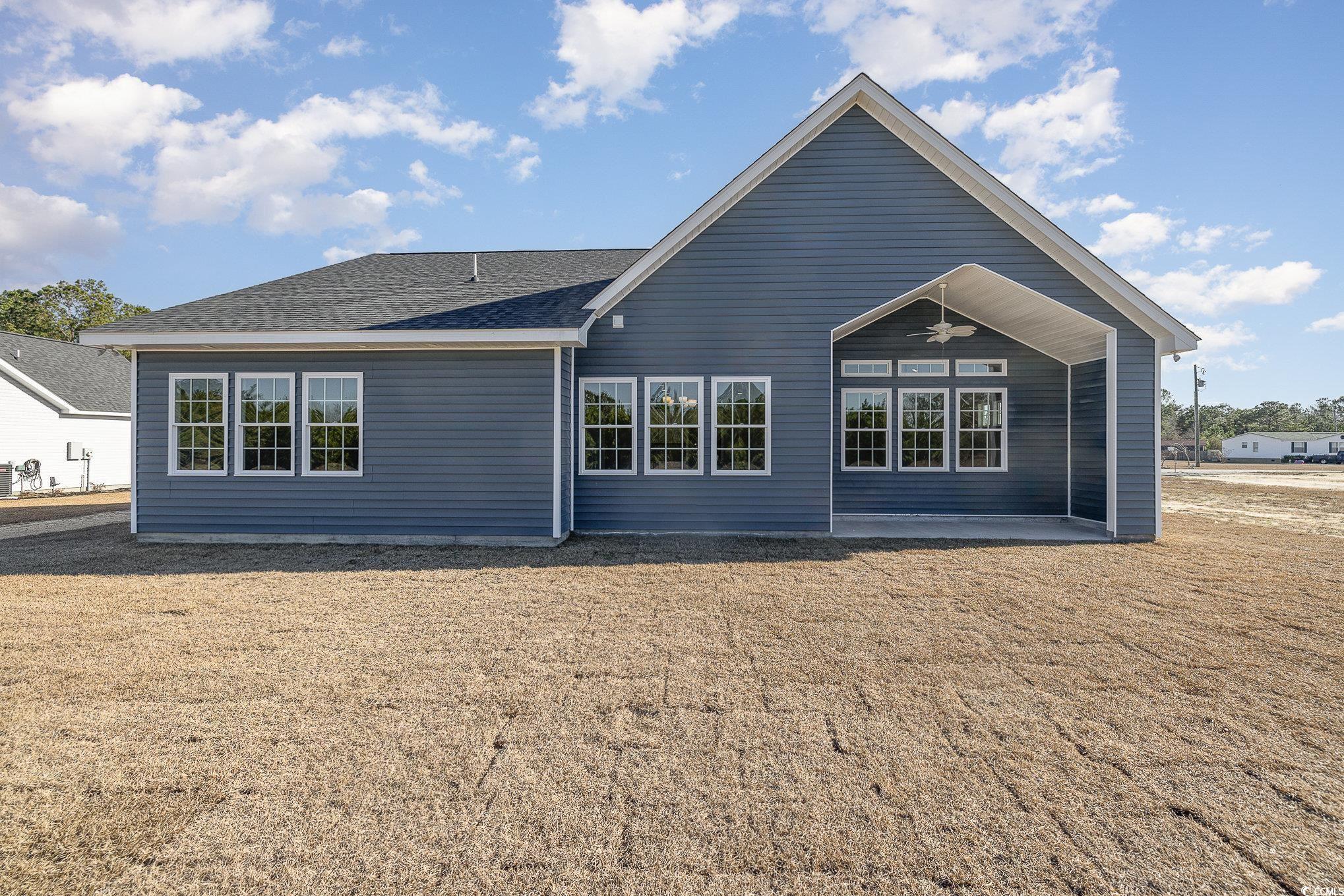 381 Log Cabin Road Loris, SC 29569 - Photo 32 of 35 Rear view of house with ceiling fan and a patio ar