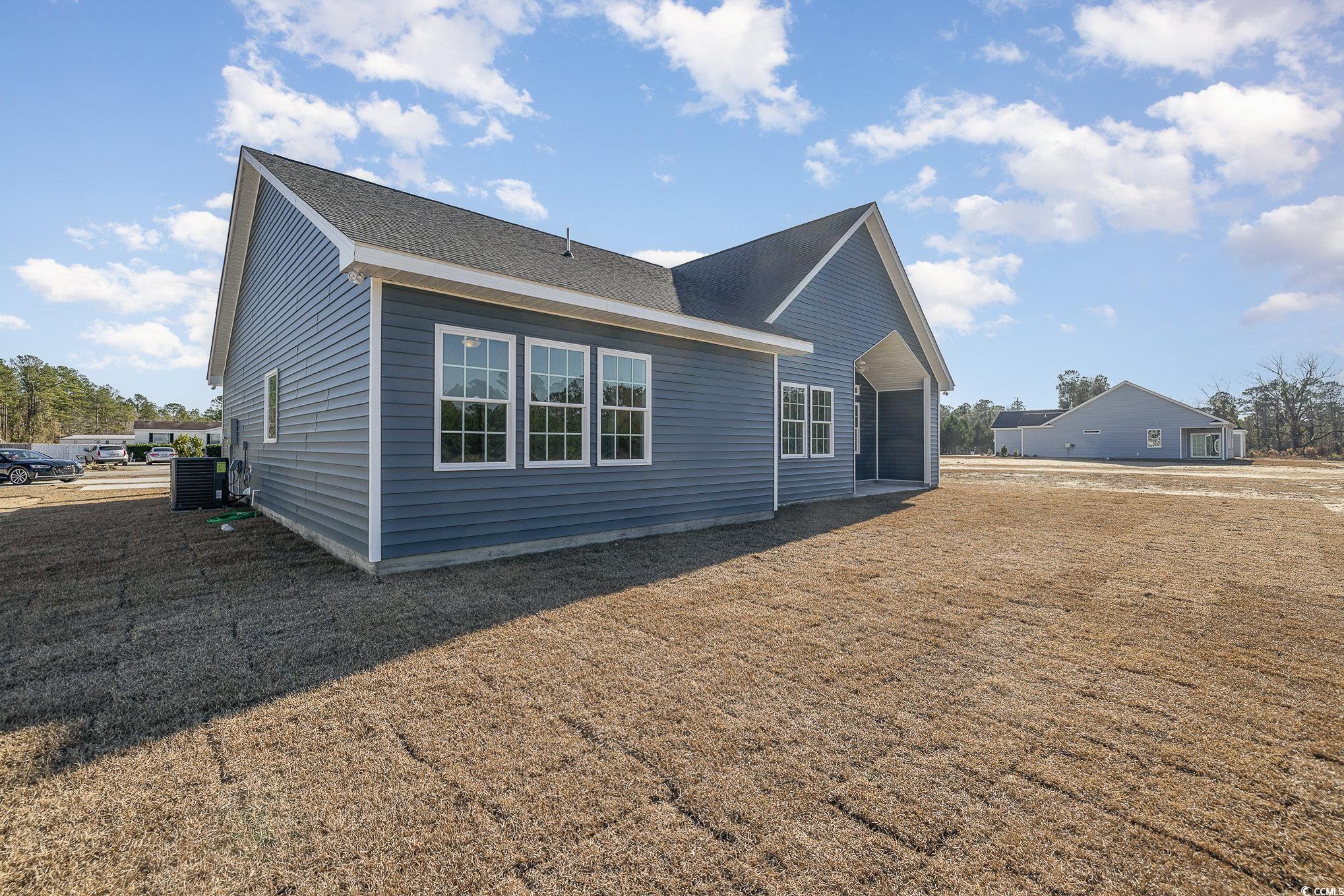 381 Log Cabin Road Loris, SC 29569 - Photo 33 of 35 Rear view of house featuring central AC unit