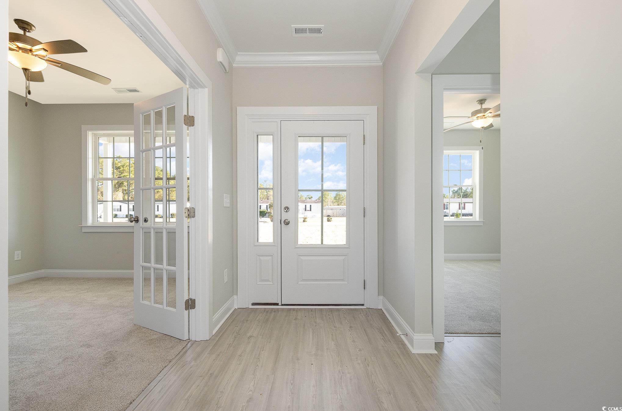 381 Log Cabin Road Loris, SC 29569 - Photo 5 of 35 Carpeted entryway featuring ceiling fan and orname