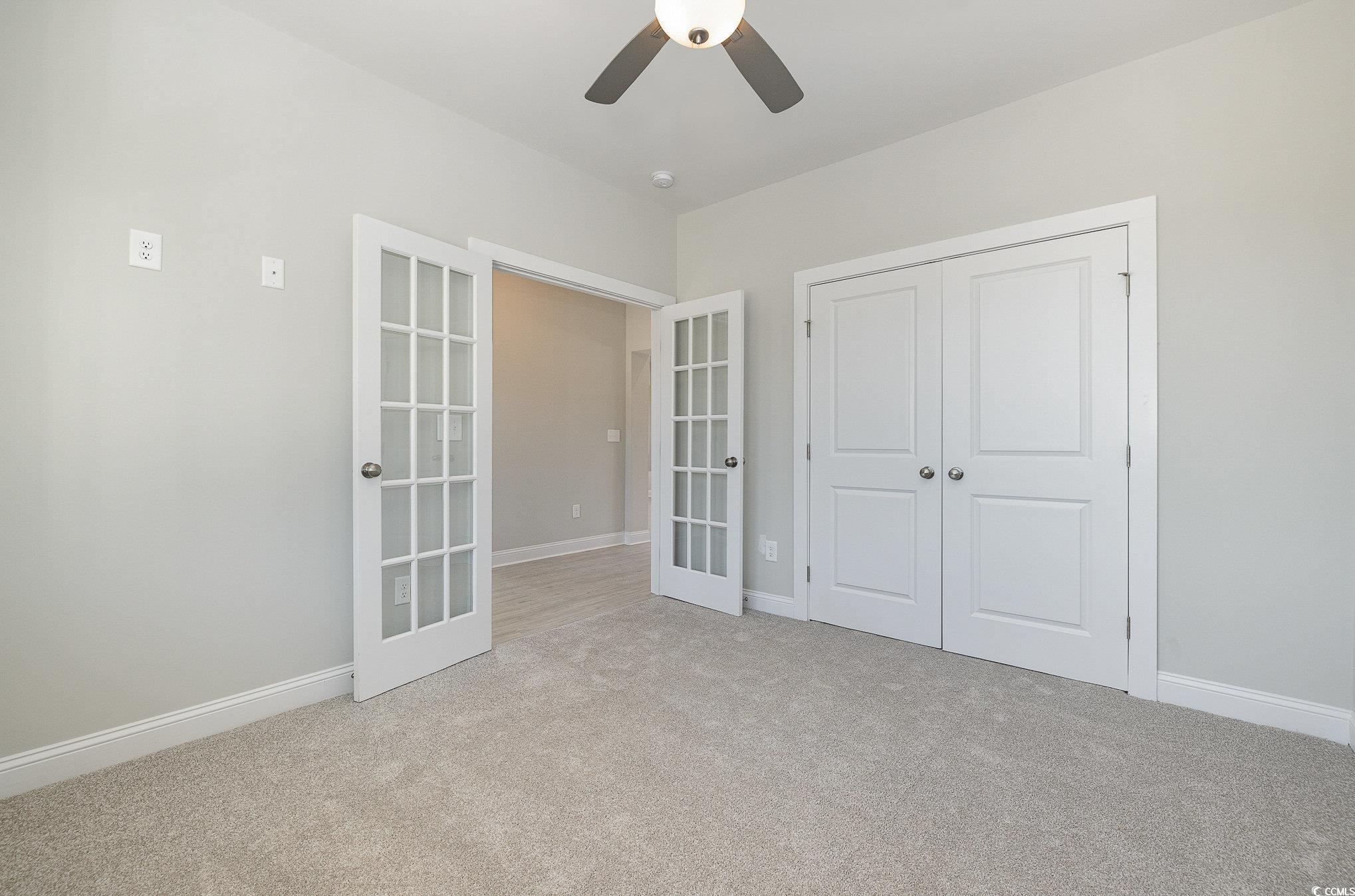 381 Log Cabin Road Loris, SC 29569 - Photo 6 of 35 Unfurnished bedroom with light carpet, french door