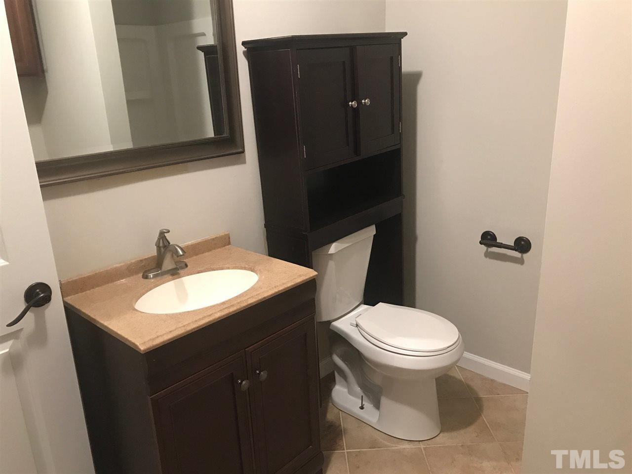 1416 Shadowview Court Raleigh, NC 27614 - Photo 14 of 28 a bathroom with a sink and a toilet
