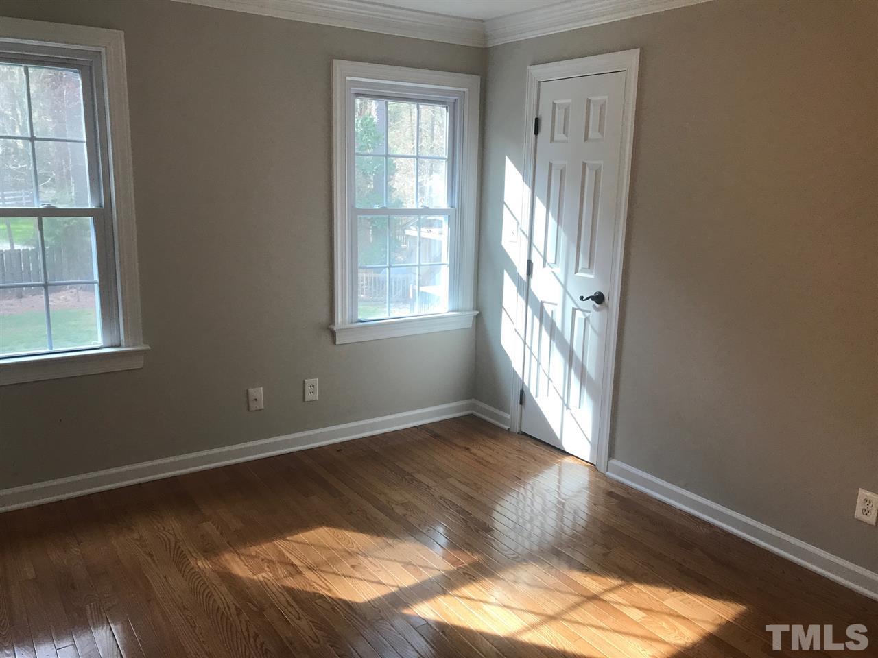 1416 Shadowview Court Raleigh, NC 27614 - Photo 18 of 28 an empty room with wooden floor and windows